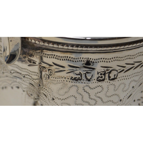 11 - Silver engraved mug, 1873, a silver cream jug and a silver porringer, 280g gross.  (3)