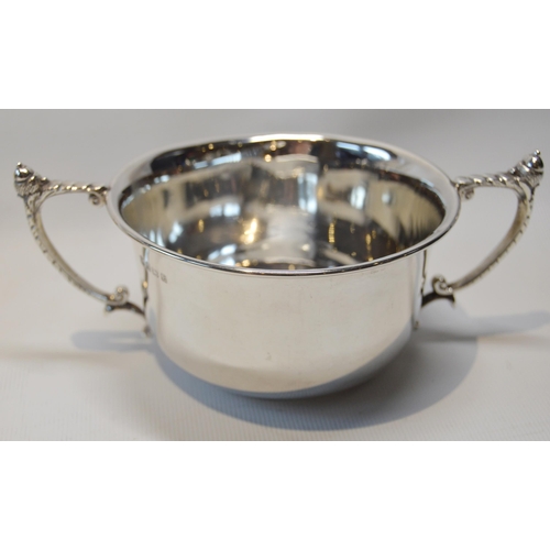 11 - Silver engraved mug, 1873, a silver cream jug and a silver porringer, 280g gross.  (3)