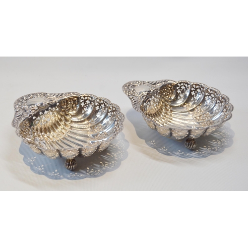 19 - Pair of silver pierced and embossed butter shells, Sheffield 1904, 140g.