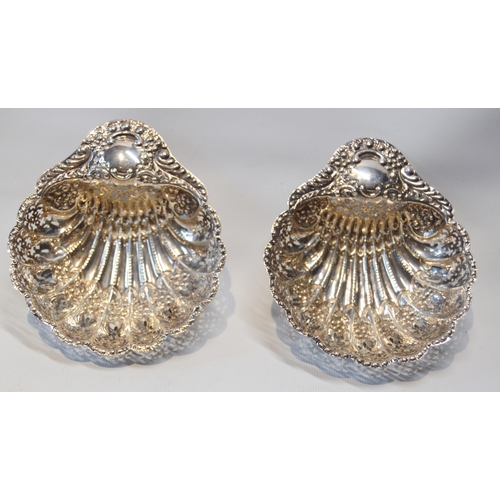 19 - Pair of silver pierced and embossed butter shells, Sheffield 1904, 140g.