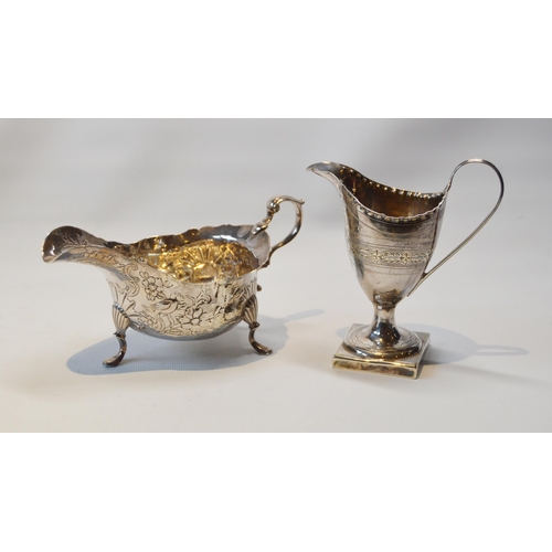 20 - Silver engraved cream jug of helmet form, by Godbehere and Wigan, 1796, and an Irish embossed silver... 