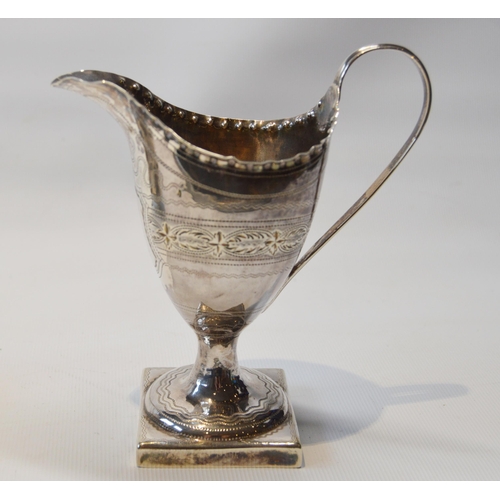 20 - Silver engraved cream jug of helmet form, by Godbehere and Wigan, 1796, and an Irish embossed silver... 