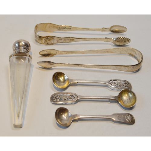 21 - Two pairs of silver sugar tongs, three silver condiment spoons, 128g gross, and a silver-mounted gla... 