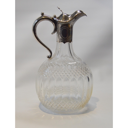 29 - Silver cut glass claret jug of ovoid form with engraved mount, by Finley and Taylor, 1889.