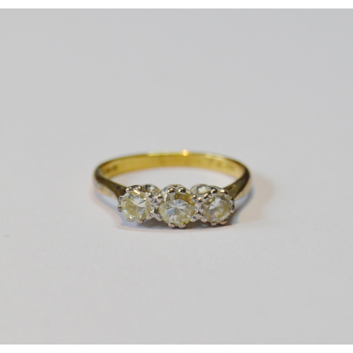 106 - Diamond three-stone ring set with pale champagne brilliants, in 18ct gold, total diamond content app... 