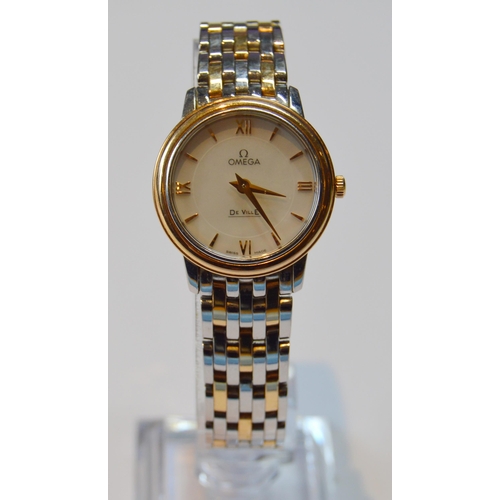 179 - Omega De Ville lady's bracelet watch, quartz, with mother of pearl dial, in gold and stainless steel... 