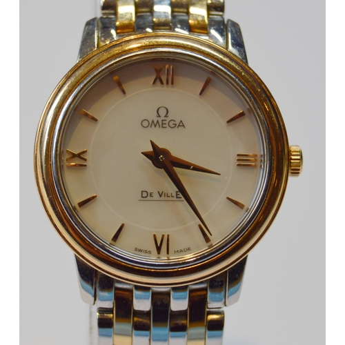 179 - Omega De Ville lady's bracelet watch, quartz, with mother of pearl dial, in gold and stainless steel... 