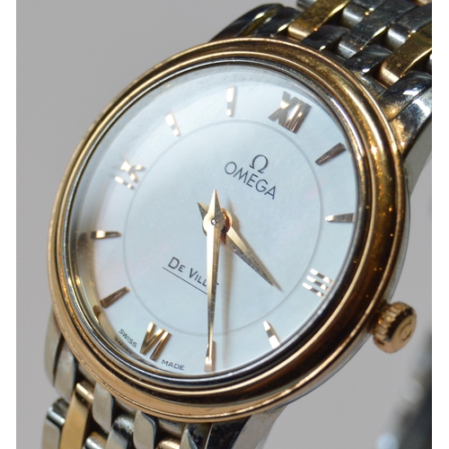 179 - Omega De Ville lady's bracelet watch, quartz, with mother of pearl dial, in gold and stainless steel... 