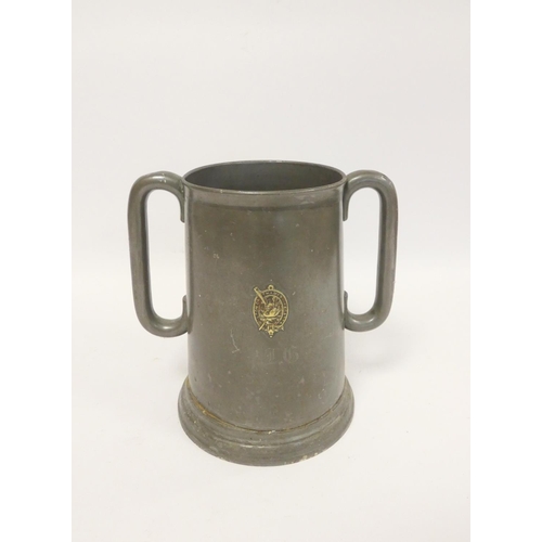 236 - 19th century prize pewter twin handled tankard, of large form, bearing crest to the obverse for Walt... 