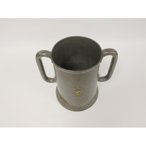 236 - 19th century prize pewter twin handled tankard, of large form, bearing crest to the obverse for Walt... 