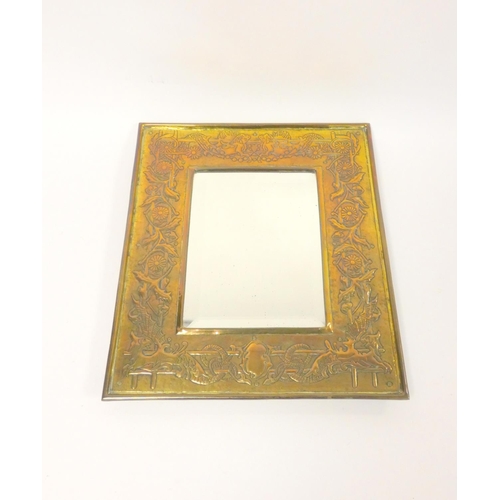 246 - Arts & Crafts brass framed wall mirror, probably Keswick School ofIndustrial Arts, the frame dec... 