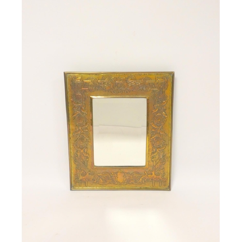 246 - Arts & Crafts brass framed wall mirror, probably Keswick School ofIndustrial Arts, the frame dec... 