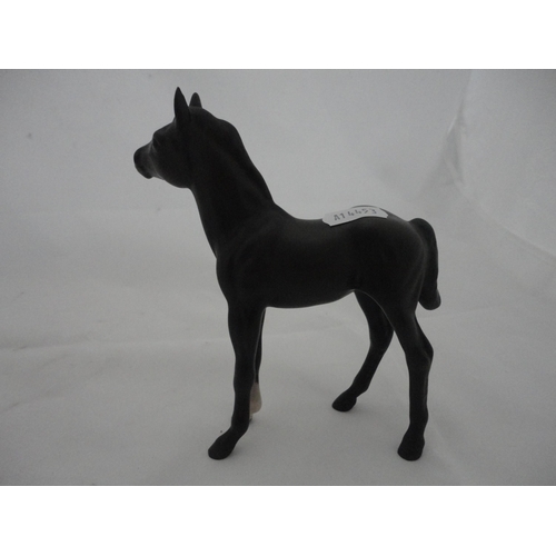 Group of four miscellaneous Beswick horse figures to include a Highland ...