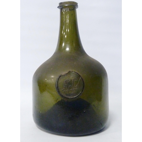 261 - George II period 18th century green glass wine bottle of mallet form, with raised circular seal bear... 