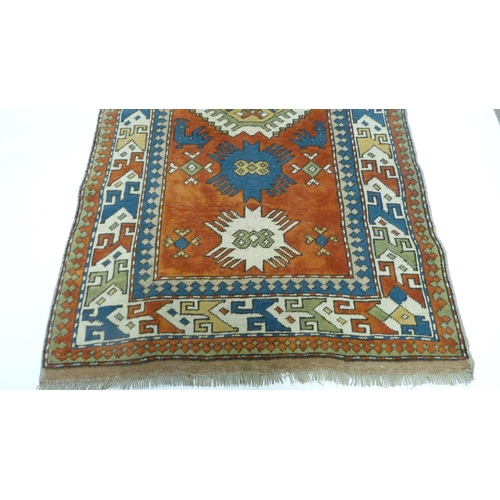 389 - Turkish (Anatolian region) hand-knotted rug decorated all over with geometric medallions, motifs and... 