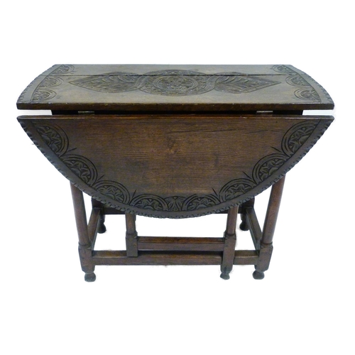 426 - Antique oak gate-leg supper table decorated with incised mouldings, united by beam understretchers, ... 