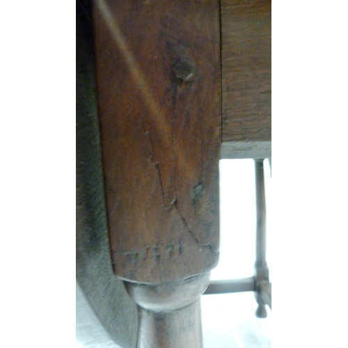 426 - Antique oak gate-leg supper table decorated with incised mouldings, united by beam understretchers, ... 