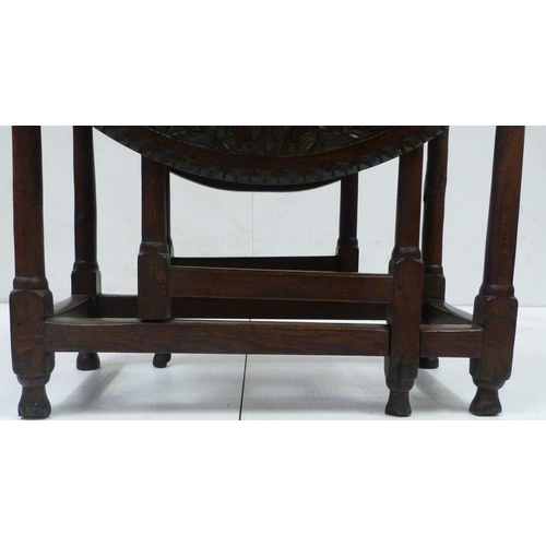 426 - Antique oak gate-leg supper table decorated with incised mouldings, united by beam understretchers, ... 