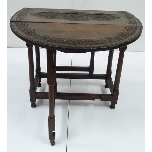 426 - Antique oak gate-leg supper table decorated with incised mouldings, united by beam understretchers, ... 