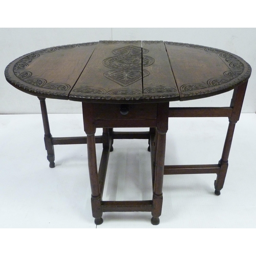 426 - Antique oak gate-leg supper table decorated with incised mouldings, united by beam understretchers, ... 