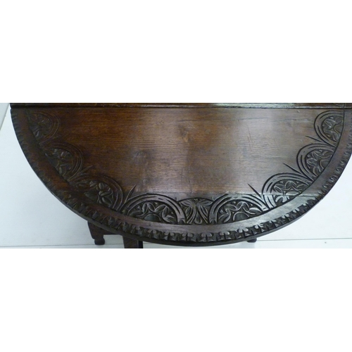 426 - Antique oak gate-leg supper table decorated with incised mouldings, united by beam understretchers, ... 