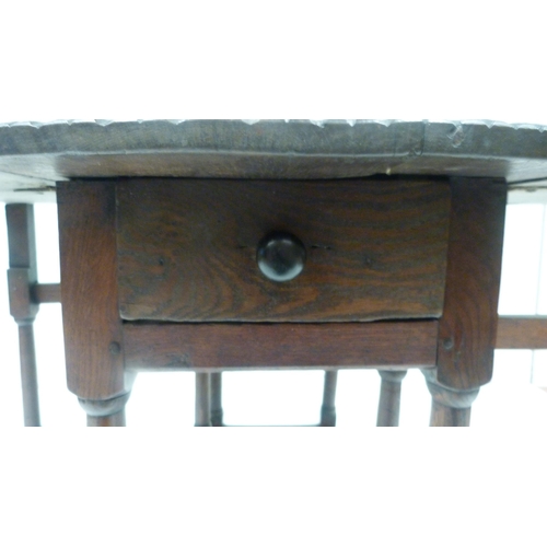 426 - Antique oak gate-leg supper table decorated with incised mouldings, united by beam understretchers, ... 