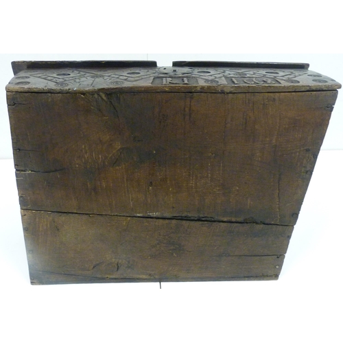 427 - 17th century oak bible box, the sloped top with iron mounts and lock, incised concentric roundels to... 