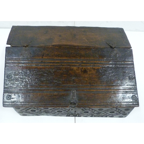 427 - 17th century oak bible box, the sloped top with iron mounts and lock, incised concentric roundels to... 