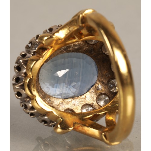 61 - Ladies blue topaz and diamond ring, Central stone surrounded by fourteen brilliant cut 0.1 carat dia... 