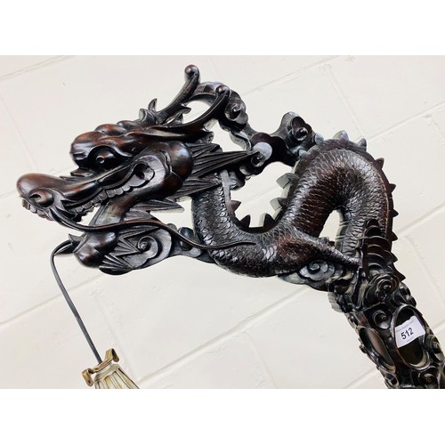 512 - Oriental style carved hardwood free standing lamp in the form of a dragon, with droplet leaded lamp,... 