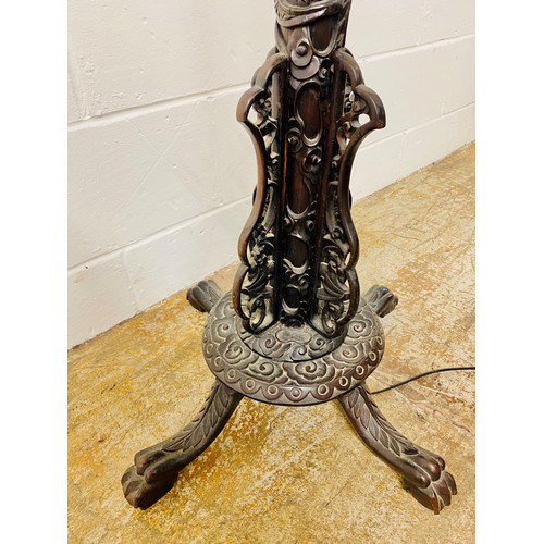 512 - Oriental style carved hardwood free standing lamp in the form of a dragon, with droplet leaded lamp,... 