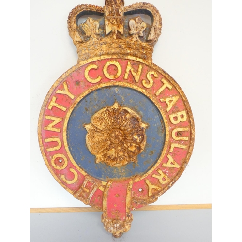 343 - 1930s painted cast iron County Constabulary circular wall plaque, with central rose beneath crown. H... 