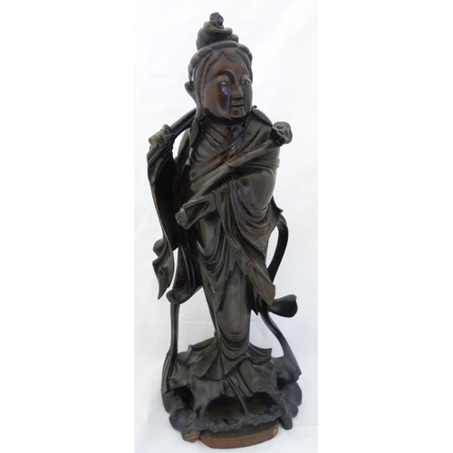 275 - Chinese carved hardwood sculpture, modelled as the goddess Guanyin holding a ruyi sceptre, fixed to ... 