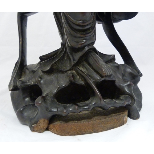 275 - Chinese carved hardwood sculpture, modelled as the goddess Guanyin holding a ruyi sceptre, fixed to ... 