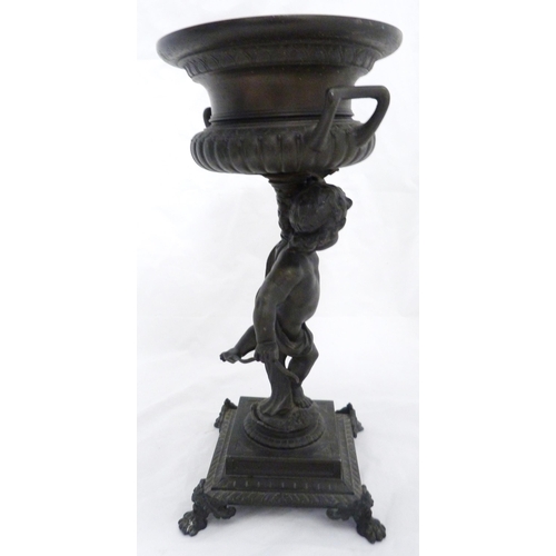 209 - Pair of Victorian Patent spelter urns, converted to table lamps, each raised aloft by a classical pu... 