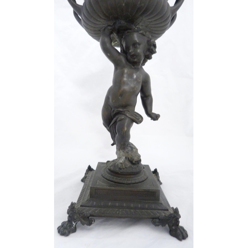 209 - Pair of Victorian Patent spelter urns, converted to table lamps, each raised aloft by a classical pu... 