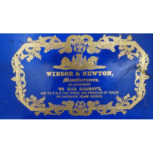 213 - Winsor & Newton mahogany artist's paint box, 19th century, the hinged cover with gilt printed la... 