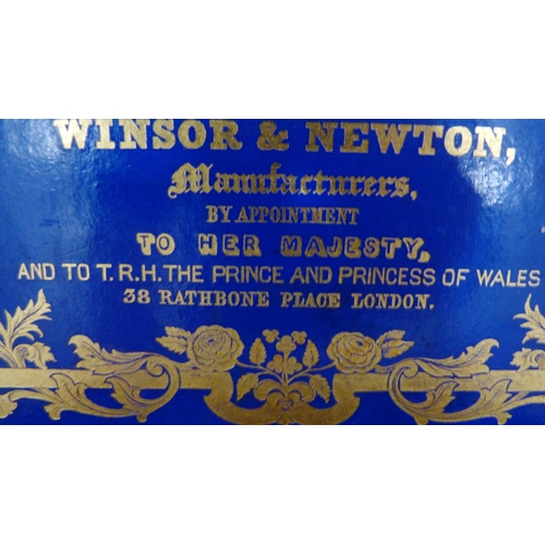 213 - Winsor & Newton mahogany artist's paint box, 19th century, the hinged cover with gilt printed la... 