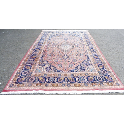 391 - Persian Heriz hand-knotted rug with all over foliage, on pink, beige and blue field, on red ground, ... 