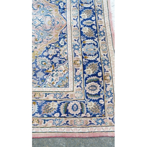 391 - Persian Heriz hand-knotted rug with all over foliage, on pink, beige and blue field, on red ground, ... 