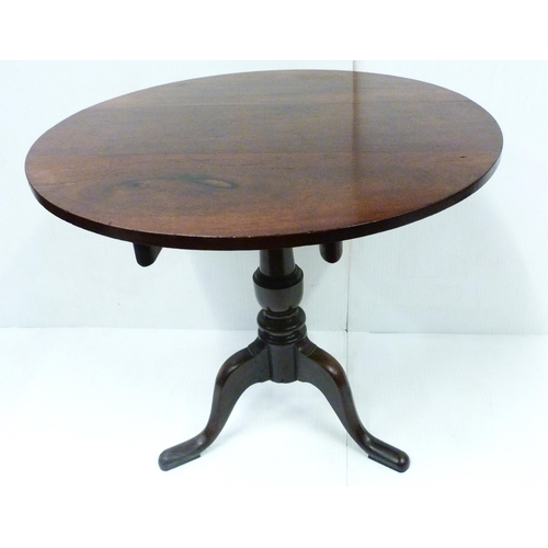 431 - George III mahogany snap-action supper table, with saucer top on turned baluster column and shaped t... 