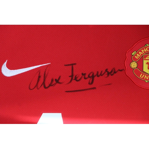 447 - Framed Manchester United football top with Alex Ferguson autograph signature, MUFC below, frame size... 