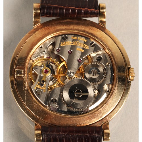 125 - Gents 9ct gold Jaeger-le-coultre wrist watch, on a brown leather strap.