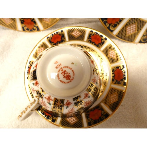 63 - Crown Derby Imari pattern cake plate a similar plate, cup and saucer. (4)