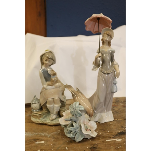 103 - Lladro models of a lady with a parasol, a girl with puppy, and a bird and ladybird.