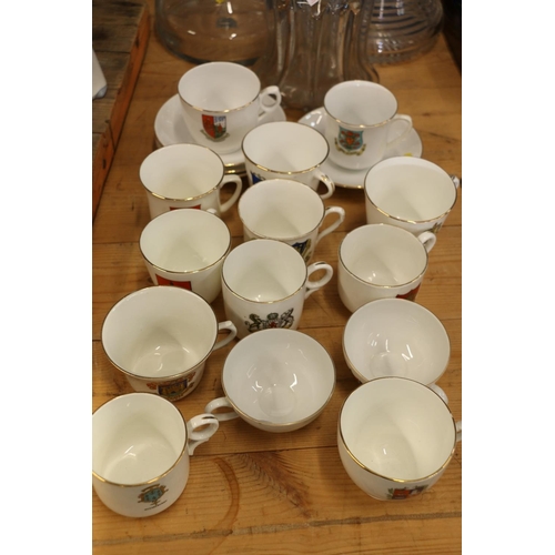 105 - Crested china cups and saucers.