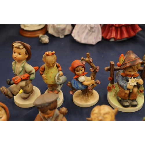 159 - Seven Hummel figurines and a German carved wooden figurine.