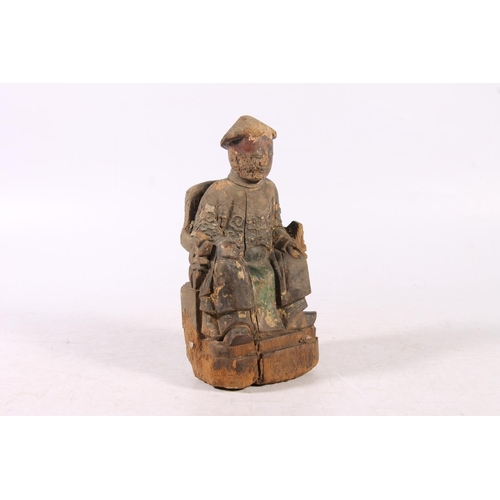 212 - Antique Chinese carved wooden figurine of gentleman seated, 21cm high.