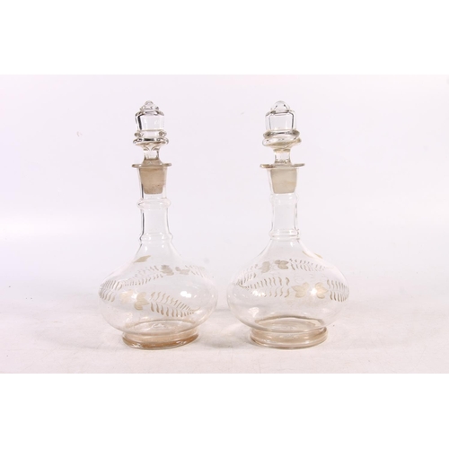 216 - Graduated pair of Victorian glass decanters, 28cm high.