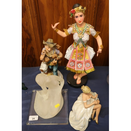 24 - Figurine of an Indonesian dancer and three other figurines, largest 40cm high.